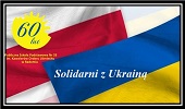 Flaga Ukrainy - kolory niebiesko-żółty, na fladze napis Solidarni z Ukrainą